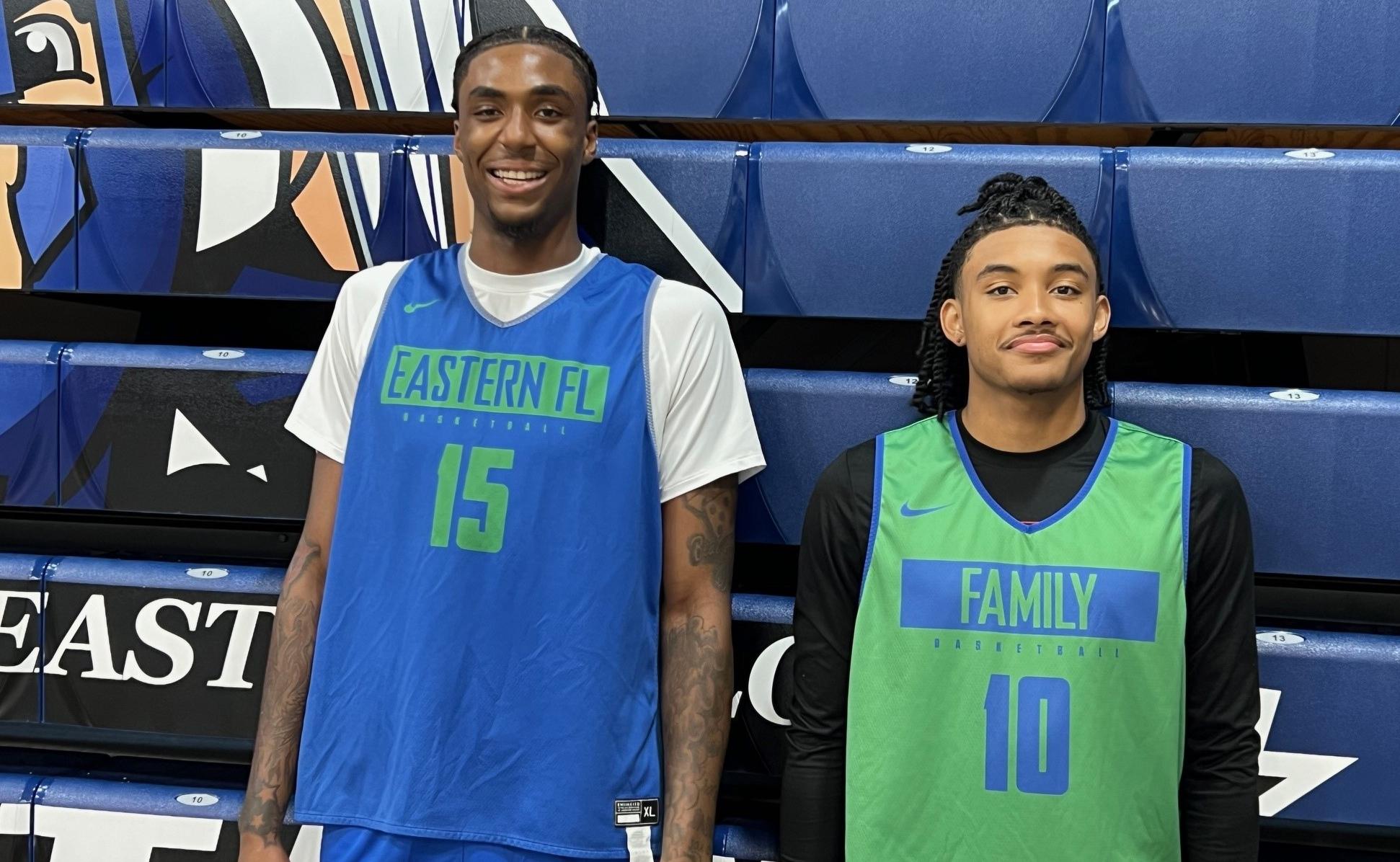 Two men's basketball players attend basketball academy